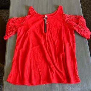 Red in color, never worn! Shoulder cut out,